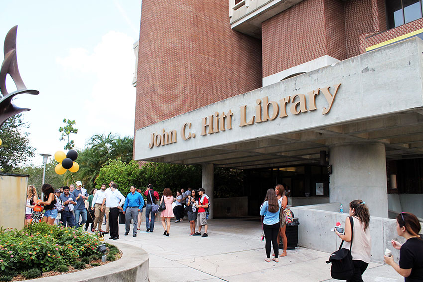Photo of front entrance to John C. Hitt library and the Flame of Hope
