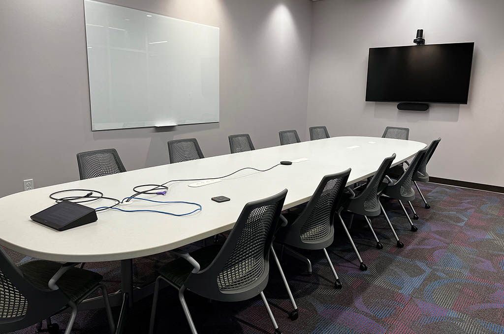 eeting Room 360H with 10 seats, a whiteboard, and mounted monitor with camera and microphone.