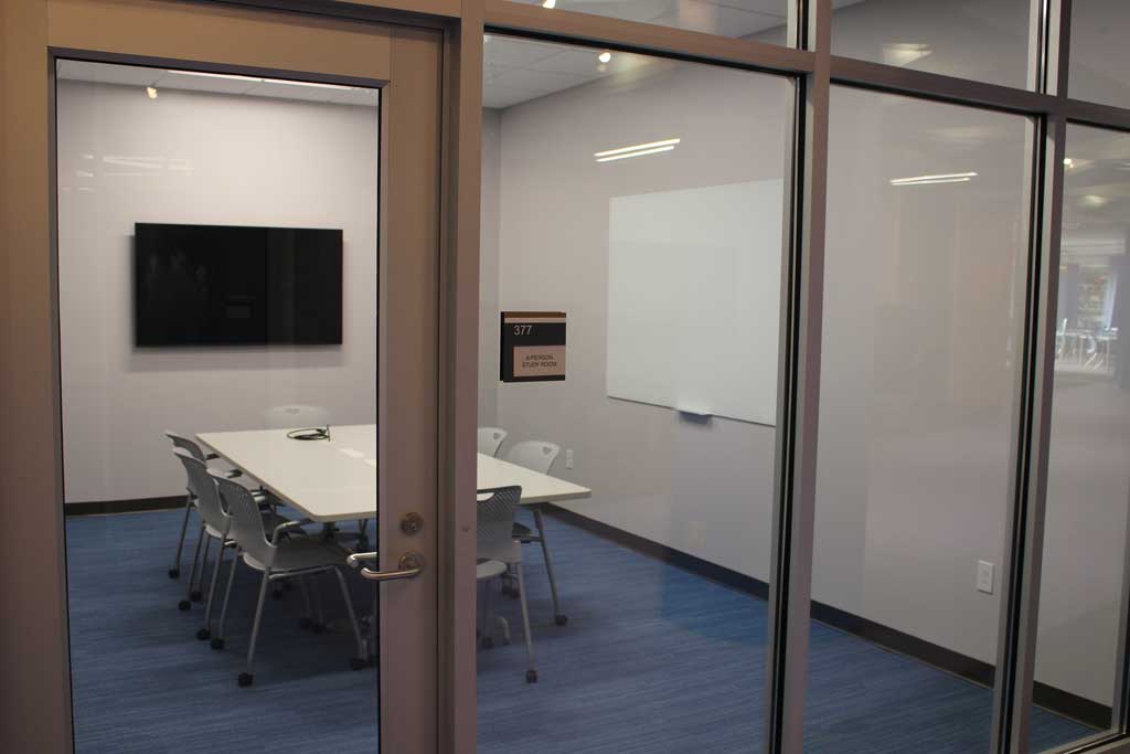 Study Room 377 with whiteboard, monitor, and 8 seat capacity