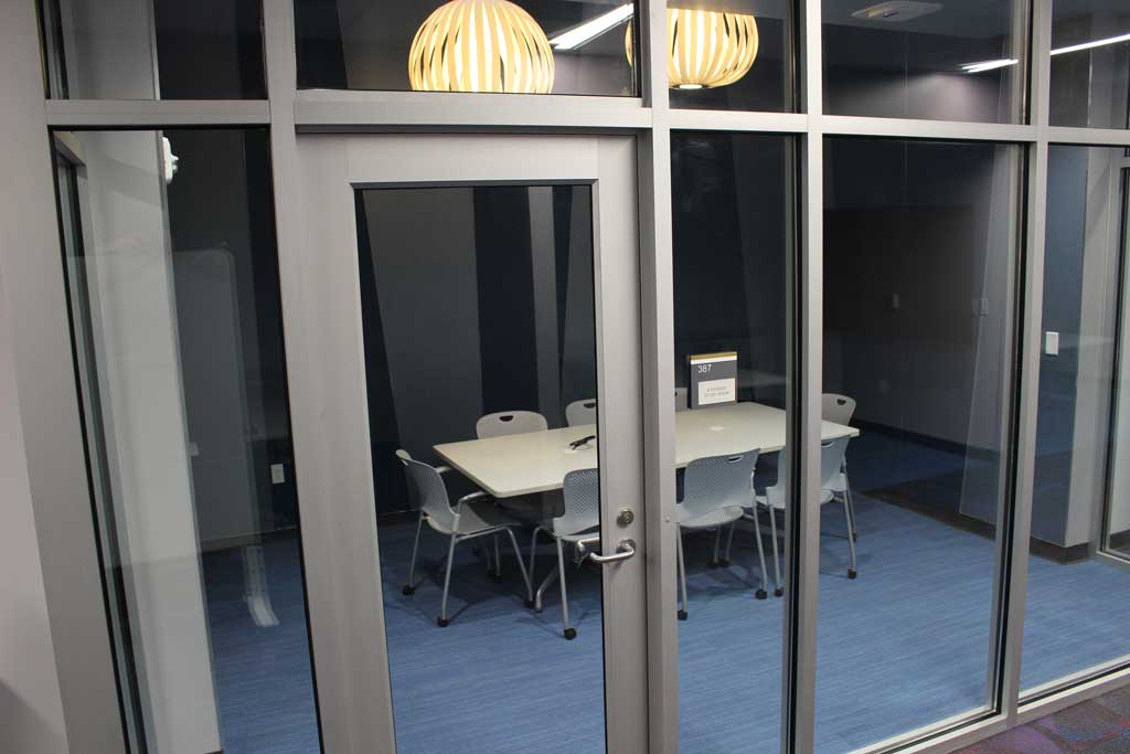 Study Room 387 with whiteboard, monitor, and 8 seat capacity