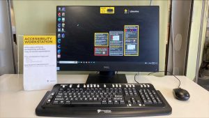 Accessibility workstation showcasing large print keyboard and installed accessibility software.