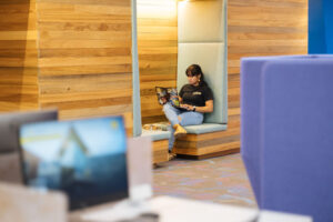 A student studying quietly in a booth
