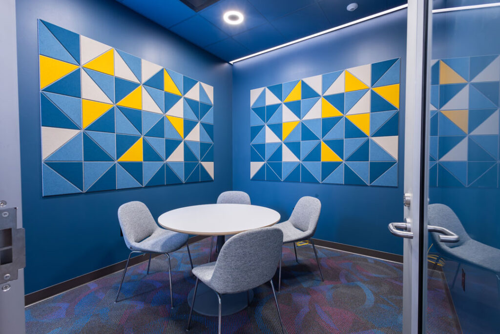 Small room with a round table and four chairs.